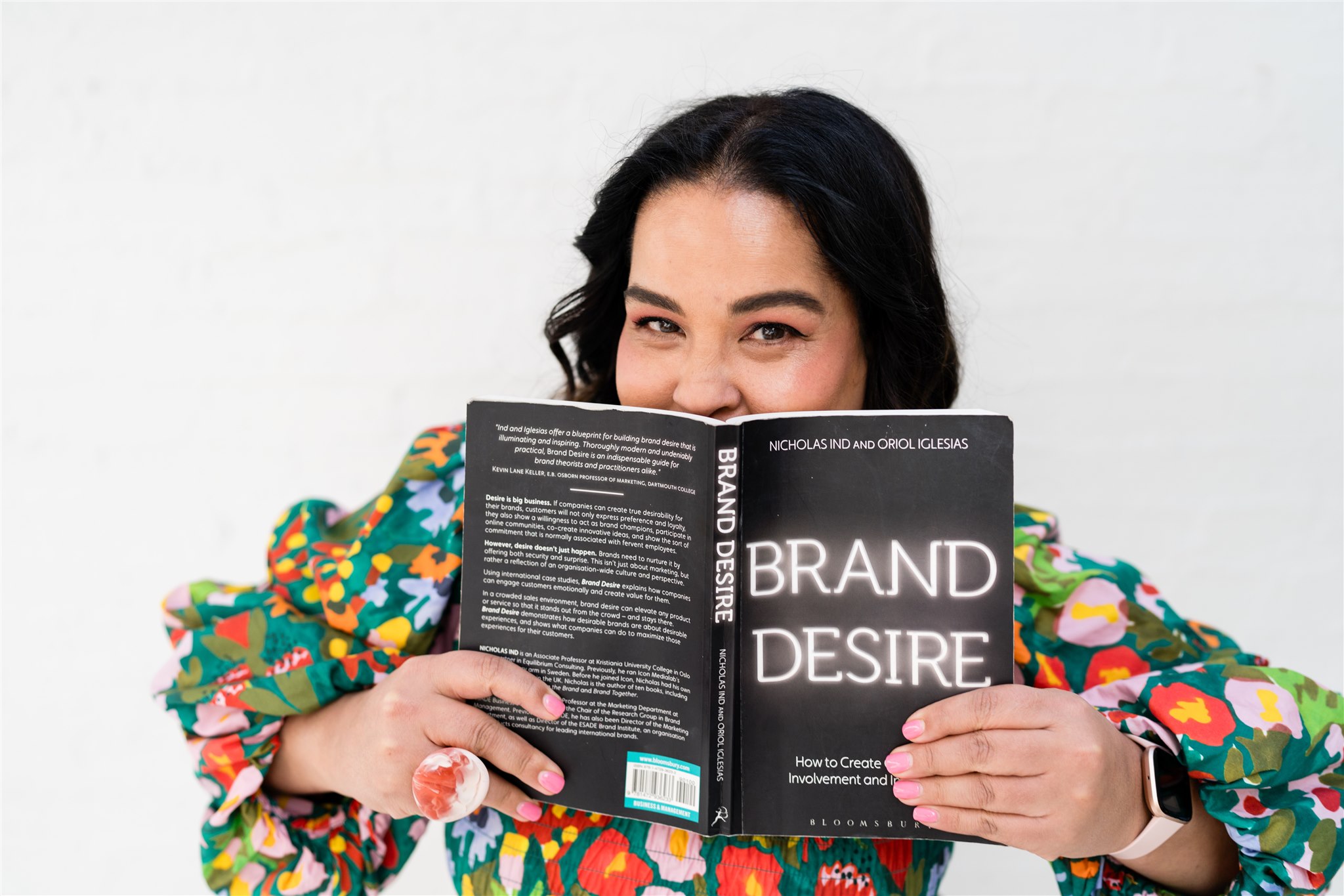 A photo of suz chadwick with a book called Brand desire.